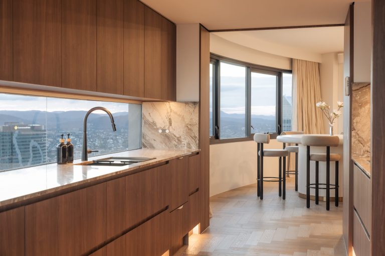 Custom Cabinetry Gallery in Brisbane | Brisbane Kitchen Design Trends for 2025 | Dana Kitchens | Modern timber finish kitchen with natural stone